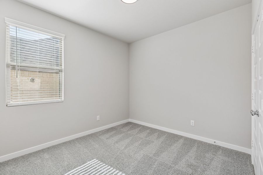 Bedroom in the Holden home plan by Trophy Signature Homes – REPRESENTATIVE PHOTO Bedroom in the Holden home plan by Trophy Signature Homes – REPRESENTATIVE PHOTO