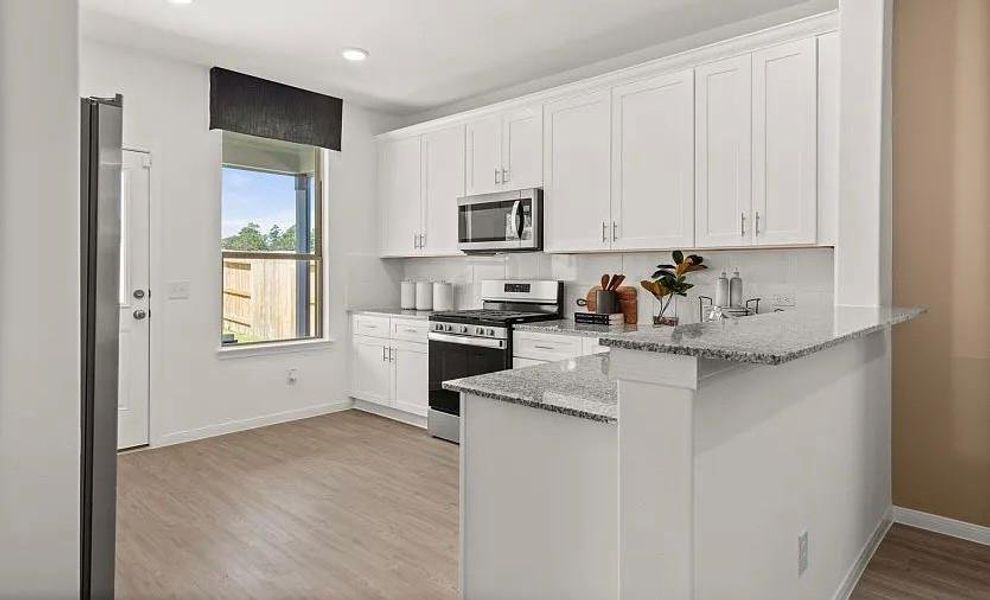 Furnished interior view inside a new home in The Pines At Seven Coves, Willis (Image 4).