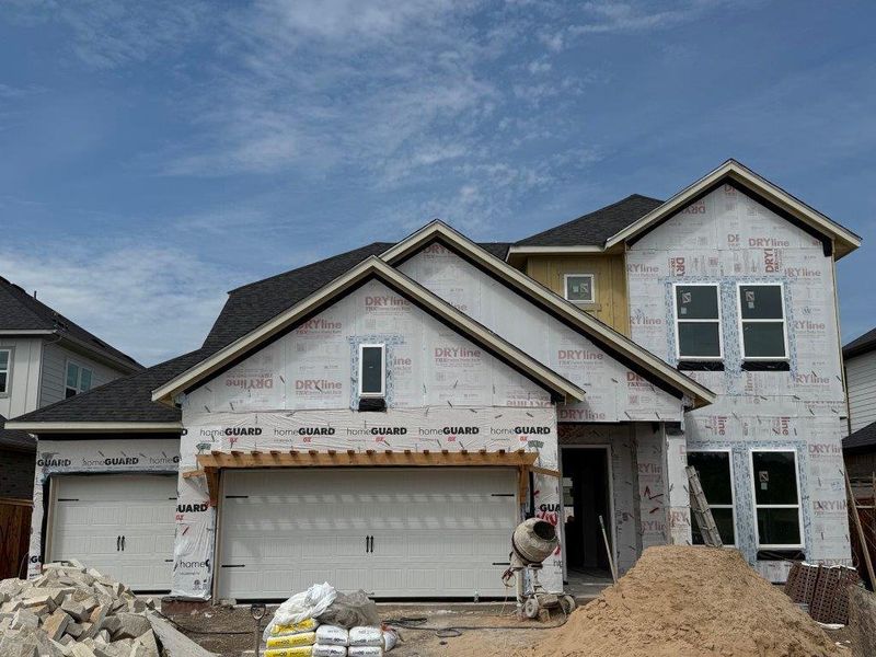 Front exterior of a new home in Barksdale, Leander, TX, highlighting curb appeal (Image 2). Front exterior of a new home in Barksdale, Leander, TX, highlighting curb appeal (Image 2).