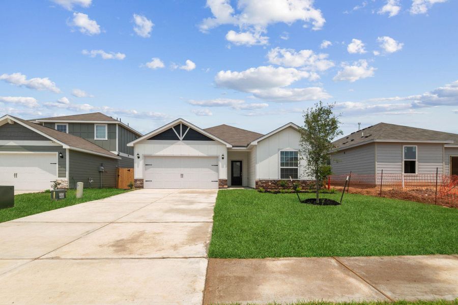 Front exterior of a new home in Trails at Cochran Ranch, Waller, TX, highlighting curb appeal (Image 2). Front exterior of a new home in Trails at Cochran Ranch, Waller, TX, highlighting curb appeal (Image 2).