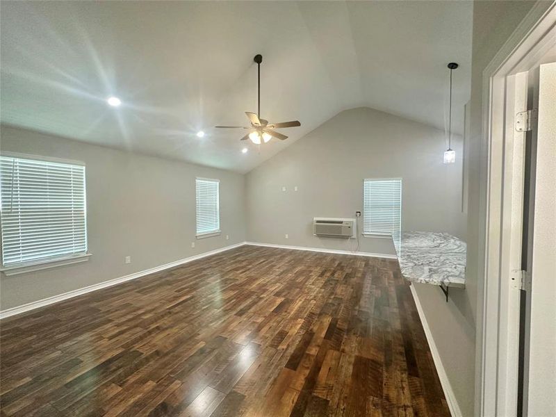 Upstairs Living Room with mini split, vaulted ceilings, ceiling fan and LVP flooring Upstairs Living Room with mini split, vaulted ceilings, ceiling fan and LVP flooring