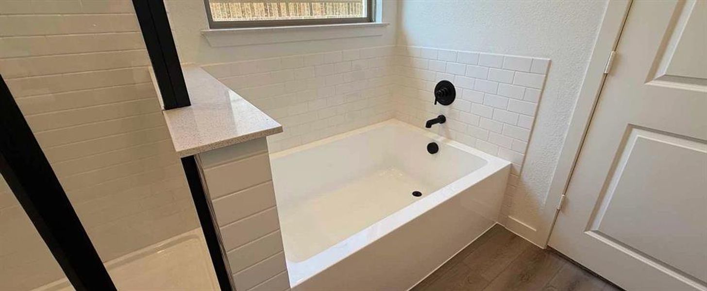 Primary Bathroom featuring garden tub