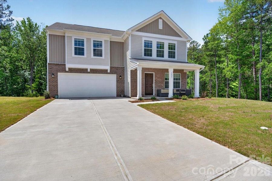 Front exterior of a new home in Walkers Mill, Edgemoor, SC, highlighting curb appeal (Image 2). Front exterior of a new home in Walkers Mill, Edgemoor, SC, highlighting curb appeal (Image 2).