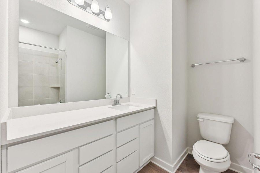 Furnished interior view inside a new home in Stallion Run, Buda (Image 9).