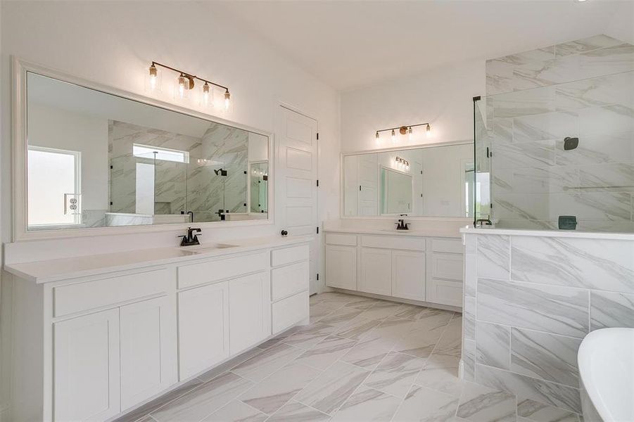 Bathroom with an enclosed shower and vanity