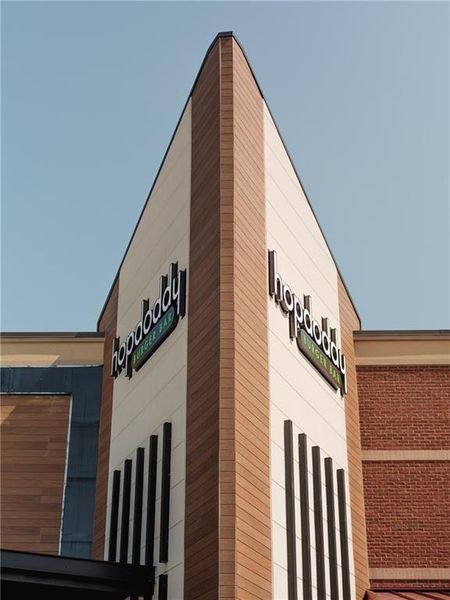 Front exterior of a new home in Palisades Townhomes, Cumming, GA, highlighting curb appeal (Image 34).