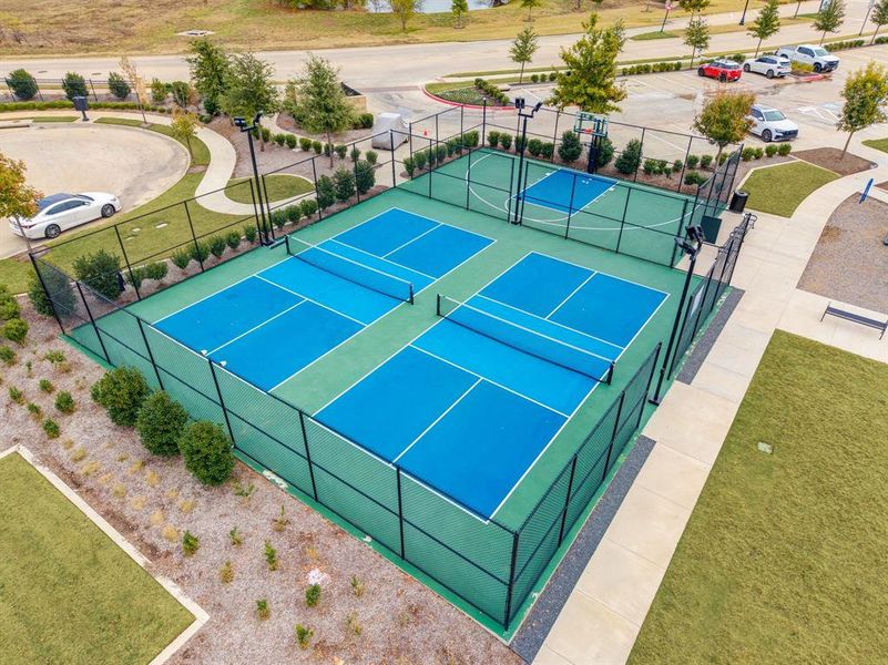 View of tennis court featuring community basketball court