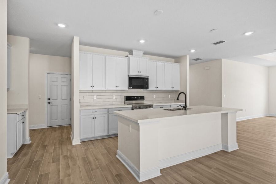 Furnished interior view inside a new home in Natureview, Freeport (Image 4).