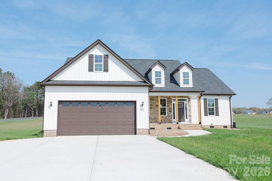Front exterior of a new home in , York, SC, highlighting curb appeal (Image 1). Front exterior of a new home in , York, SC, highlighting curb appeal (Image 1).