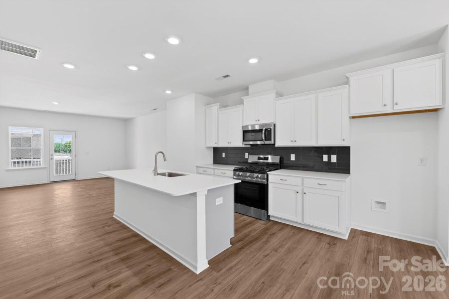 Open family room flows nicely into the kitchen