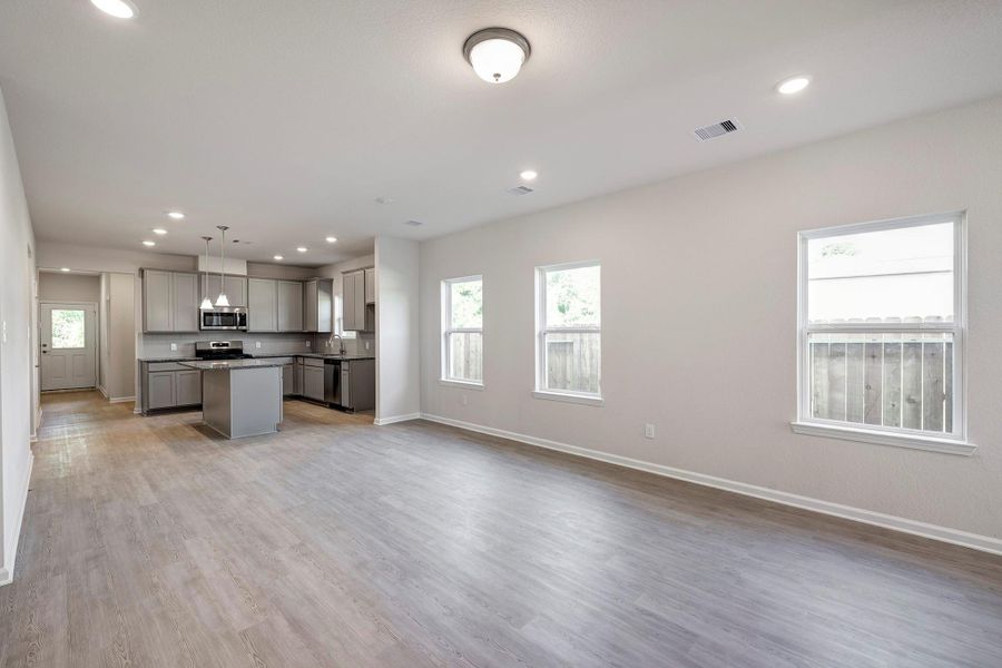 The Mockingbird II- Family Room into the Dining Area and Kitchen The Mockingbird II- Family Room into the Dining Area and Kitchen