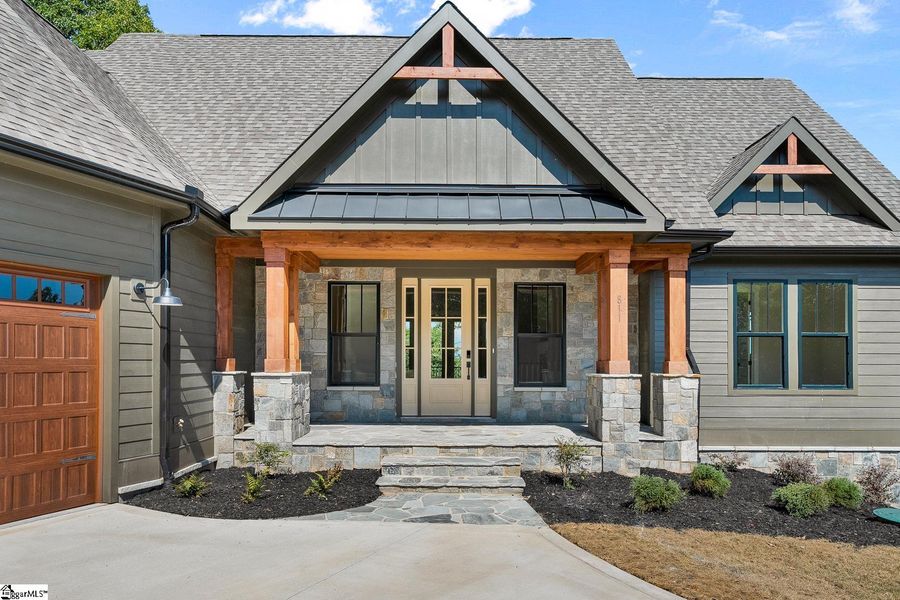 Exterior details and patio area of a home in Greenville County Homes, Landrum (Image 3).