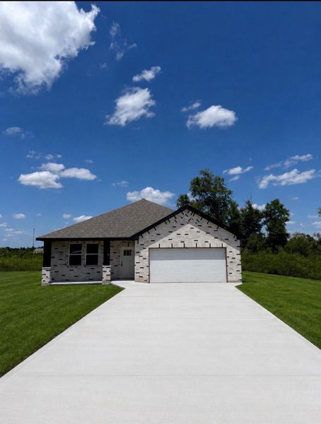 Front exterior of a new home in , Cleveland, TX, highlighting curb appeal (Image 16).