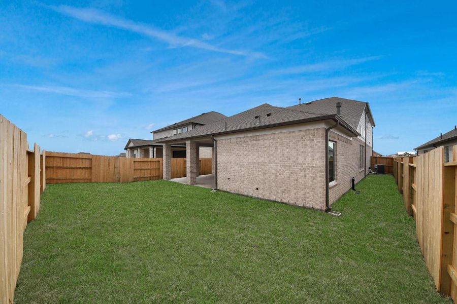 Come and see this spacious backyard with its beautiful covered patio. There is plenty of room for the kids to play and adults to relax. Perfect for your outdoor living space, patio furniture, bbq pit, and so much more. The possibilities are endless!