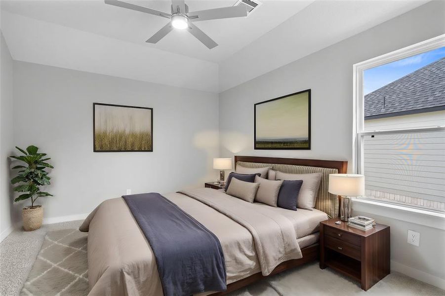 Secondary bedroom features plush carpet, custom paint, ceiling fan, large window with privacy blinds, and private access to a secondary bathroom vanity, shared shower/tub combo, and toilet.