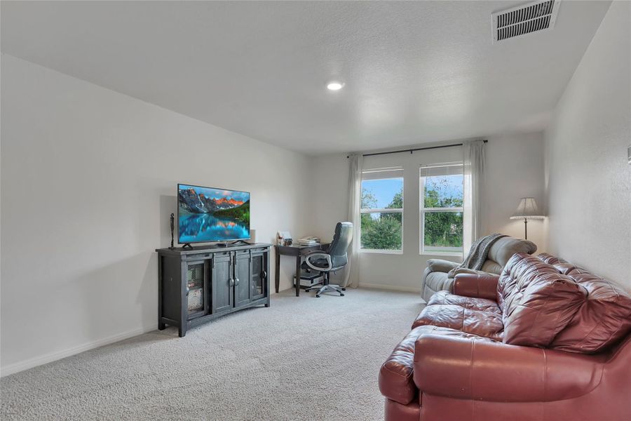 Upstairs living room - set apart from the main level, keeping noise from carrying downstairs.