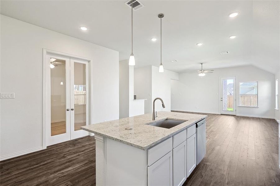 Kitchen featuring french doors, ceiling fan, dark hardwood / wood-style floors, and sink