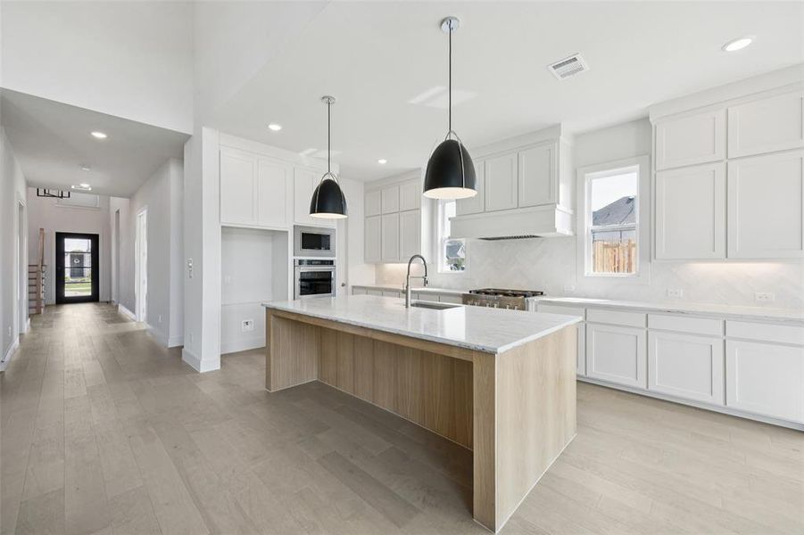 The beautiful open, light filled main entry leads into your chef's dream kitchen! The beautiful open, light filled main entry leads into your chef's dream kitchen!