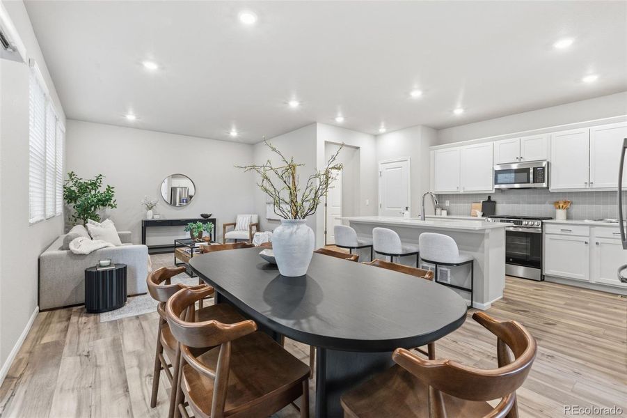 Furnished interior view inside a new home in Woodrose at Painted Prairie, Aurora (Image 8).