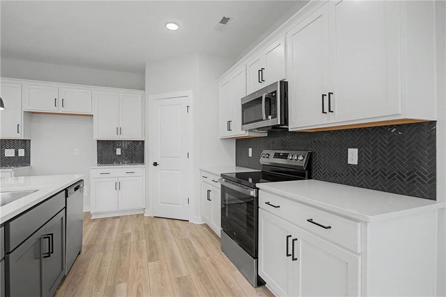 Furnished interior view inside a new home in The Park at Brighton, Locust Grove (Image 4).