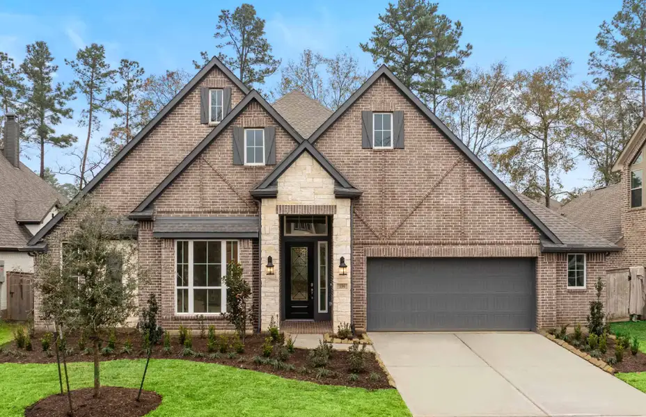 Representative exterior photo of a completed home built from the 3068 by Ravenna Homes in The Woodlands Hills 65′, Willis, TX (Image 26).