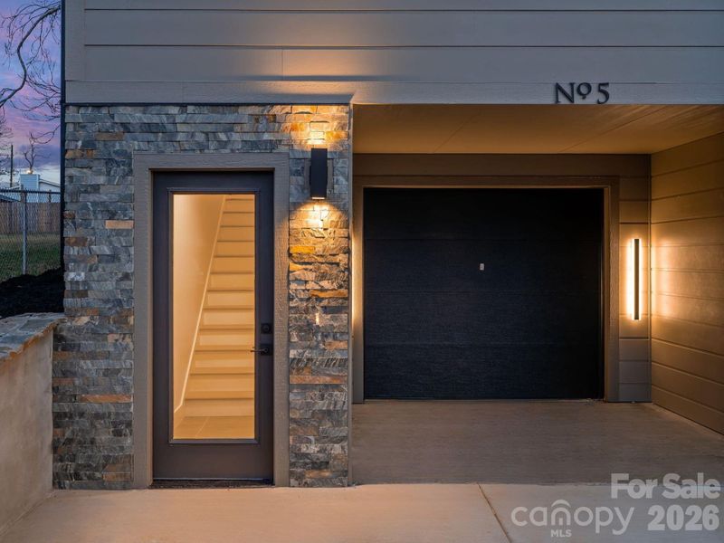 Similar Unit-Custom Lighting & Stonework at the Entryway