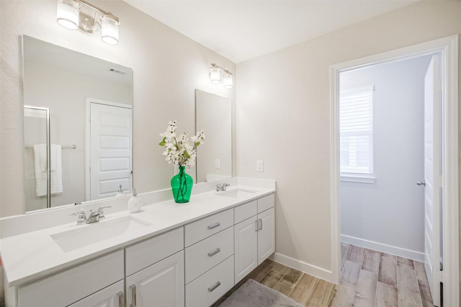 Photos are sample images from a previously built home with the same floor plan. Finishes and fixtures in the current home have been upgraded and may vary.