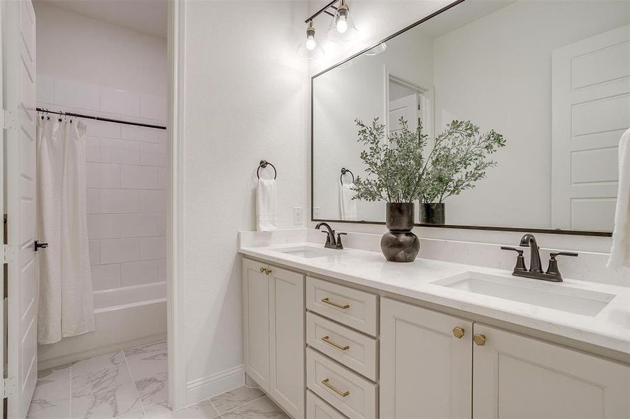 Secondary Bathroom featuring vanity and shower / bath combo