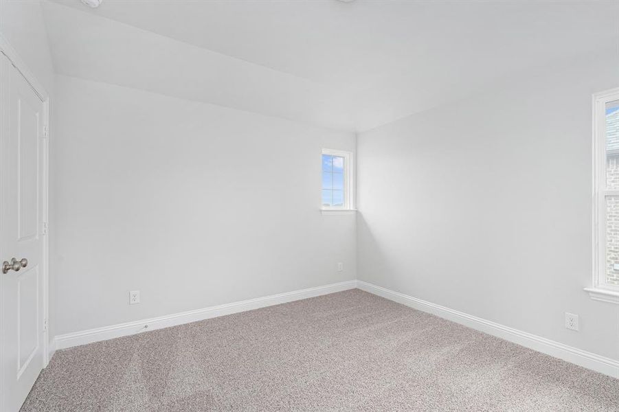 Spare room with carpet flooring and baseboards