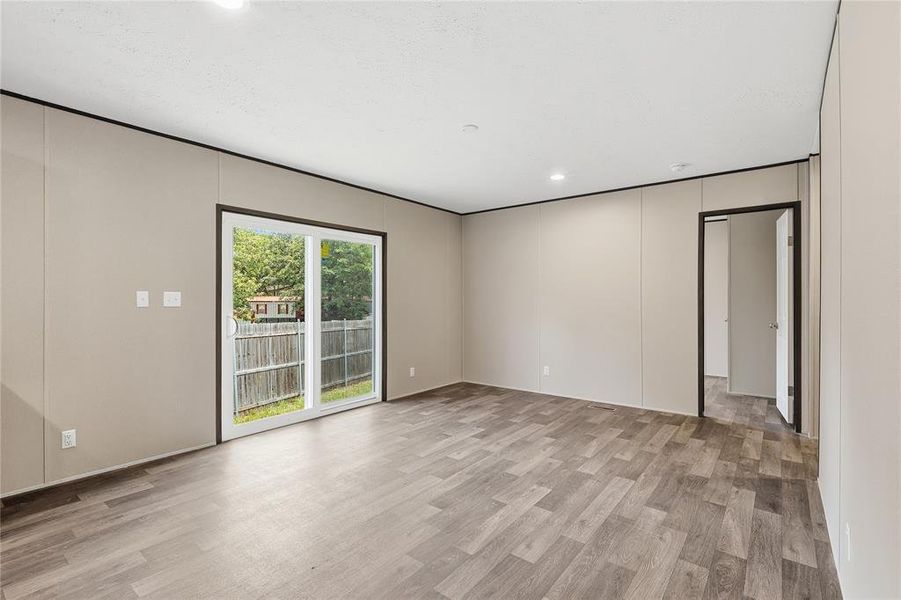 Sliding door leads to back of home.