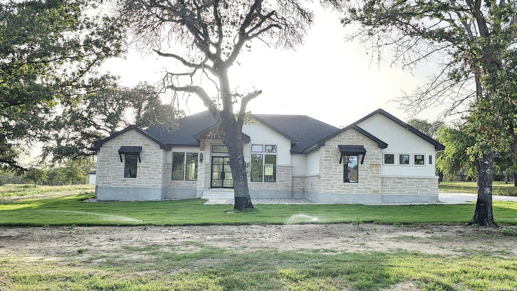 Front exterior of a new home in , Adkins, TX, highlighting curb appeal (Image 31). Front exterior of a new home in , Adkins, TX, highlighting curb appeal (Image 31).