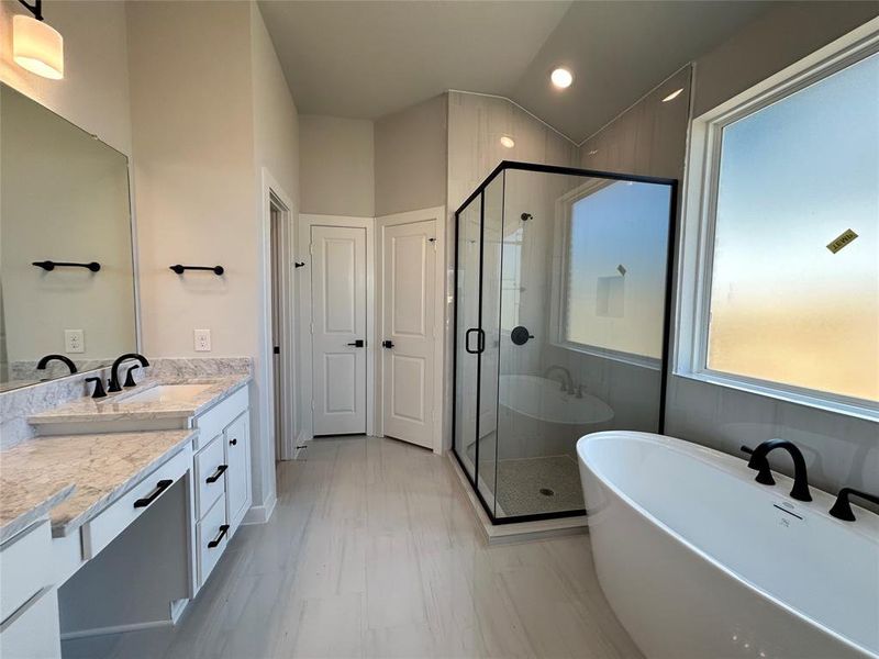 A sleek and modern bathroom vanity with a polished countertop and ample storage space, perfect for organizing essentials. The design combines clean lines with stylish fixtures, creating a functional and elegant focal point for the bathroom.