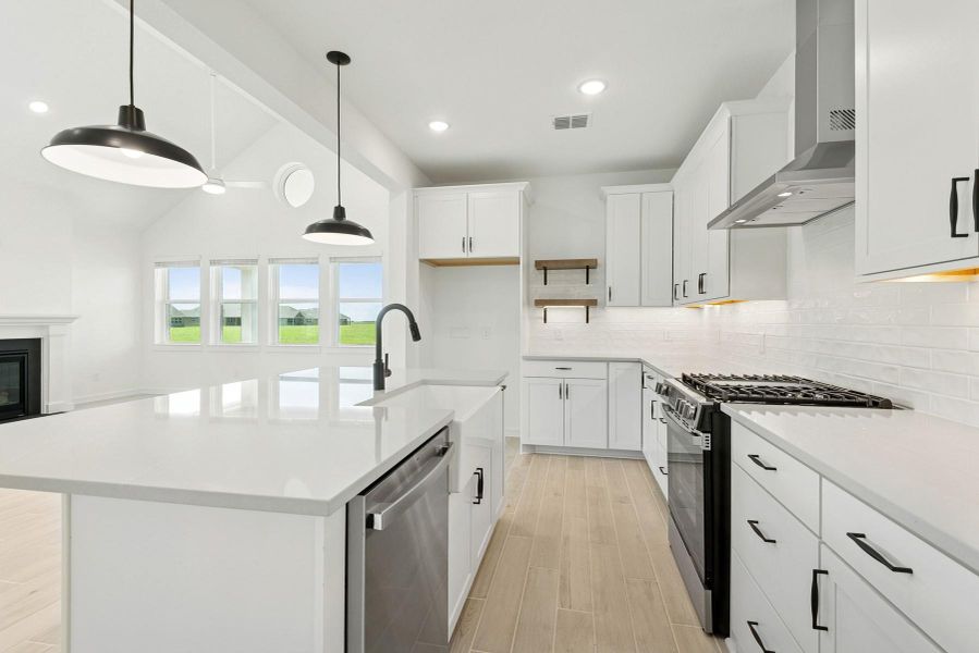 Stylish kitchen with white cabinets and quartz counters Stylish kitchen with white cabinets and quartz counters