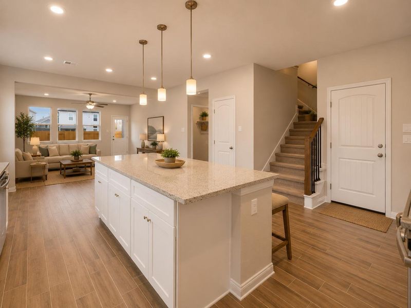 An inviting open-concept layout connects the well-appointed kitchen to a comfortable living area, ideal for gatherings. An inviting open-concept layout connects the well-appointed kitchen to a comfortable living area, ideal for gatherings.