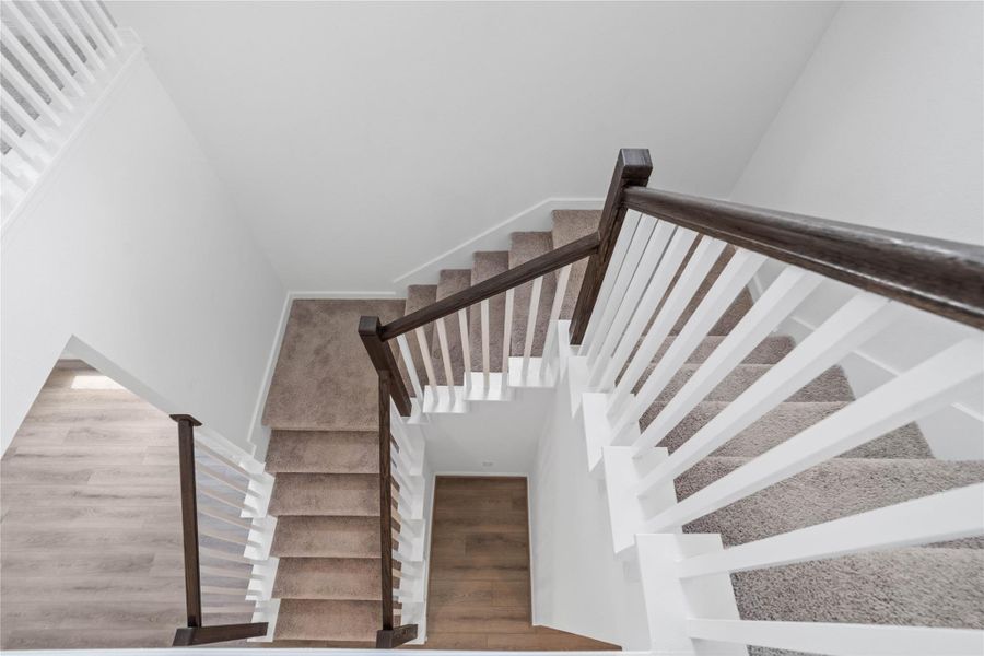 View of the staircase from the second floor and the open space.