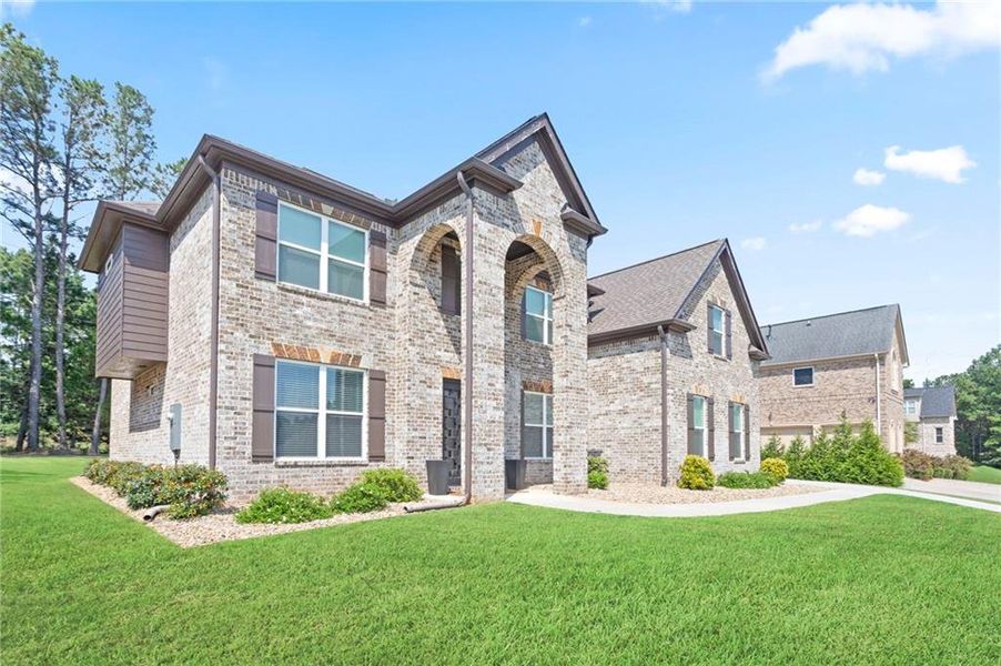 Front exterior of a new home in , Conyers, GA, highlighting curb appeal (Image 24).