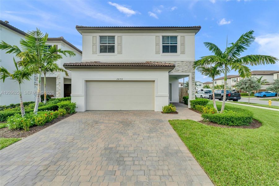 Front exterior of a new home in , Homestead, FL, highlighting curb appeal (Image 26). Front exterior of a new home in , Homestead, FL, highlighting curb appeal (Image 26).