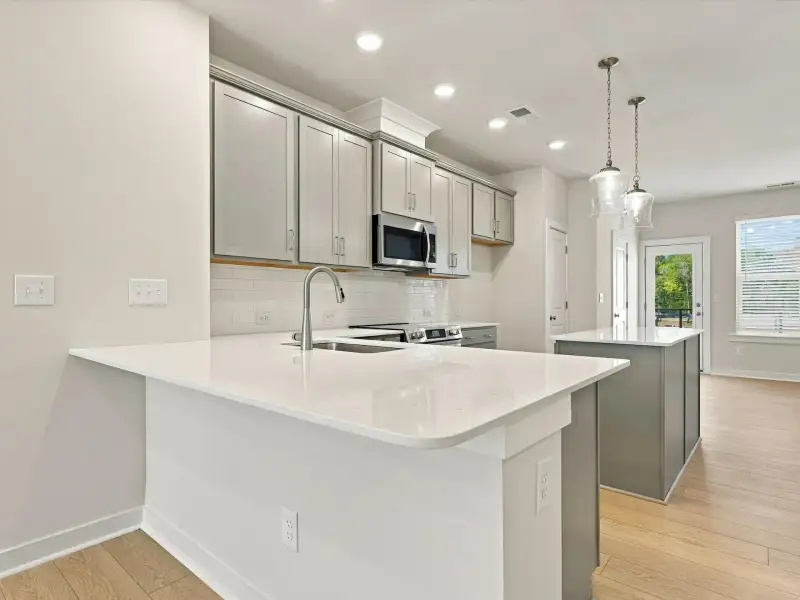 Furnished interior view inside a new home in Central Living at Craig, Charlotte (Image 7).