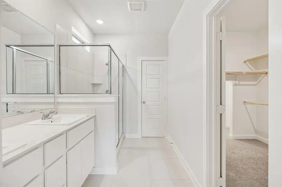 Primary Bathroom in the Stanley II home plan by Trophy Signature Homes – REPRESENTATIVE PHOTO