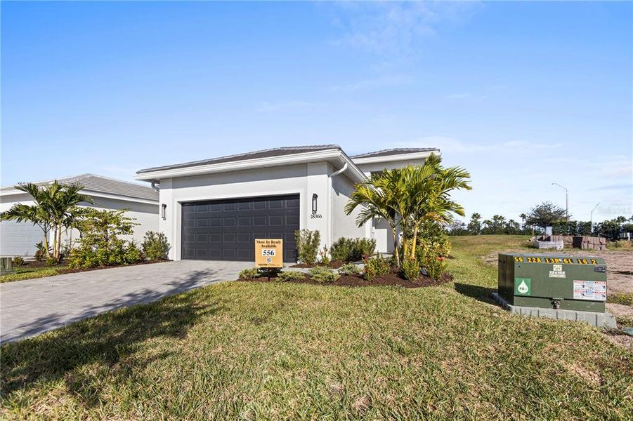 Front exterior of a new home in Cresswind Lakewood Ranch, Lakewood Ranch, FL, highlighting curb appeal (Image 2). Front exterior of a new home in Cresswind Lakewood Ranch, Lakewood Ranch, FL, highlighting curb appeal (Image 2).
