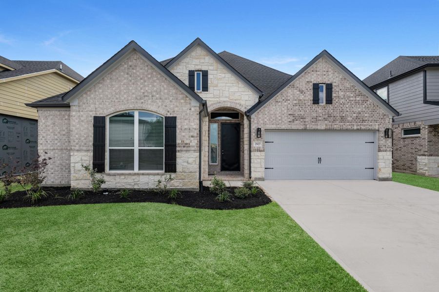 Front exterior of a new home in Morton Creek Ranch, Katy, TX, highlighting curb appeal (Image 2). Front exterior of a new home in Morton Creek Ranch, Katy, TX, highlighting curb appeal (Image 2).