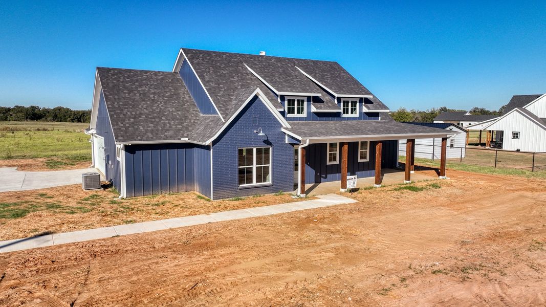 Front exterior of a new home in Horizon Meadow Estates, Paradise, TX, highlighting curb appeal (Image 20). Front exterior of a new home in Horizon Meadow Estates, Paradise, TX, highlighting curb appeal (Image 20).