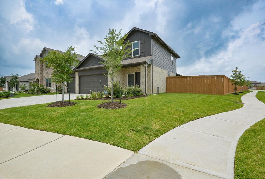 Front exterior of a new home in River Ranch Meadows, Dayton, TX, highlighting curb appeal (Image 15). Front exterior of a new home in River Ranch Meadows, Dayton, TX, highlighting curb appeal (Image 15).