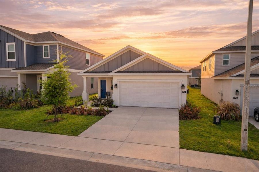 Front exterior of a new home in Cascades, Davenport, FL, highlighting curb appeal (Image 1). Front exterior of a new home in Cascades, Davenport, FL, highlighting curb appeal (Image 1).