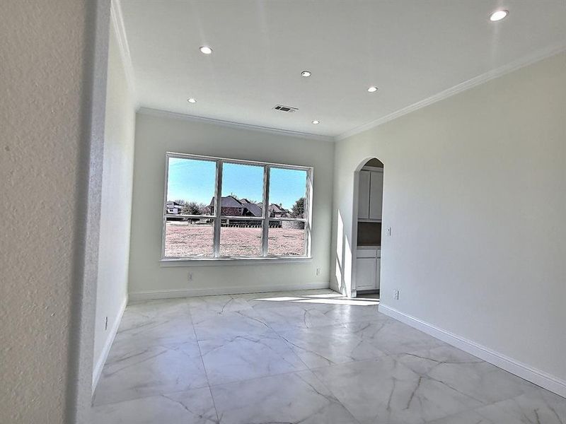 Spare room with crown molding