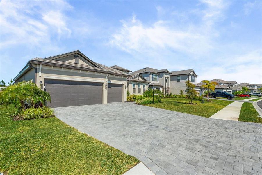 Front exterior of a new home in , Lakewood Ranch, FL, highlighting curb appeal (Image 25).