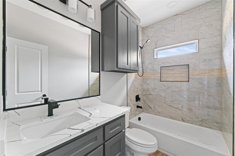 Full bathroom with bathing tub / shower combination and vanity