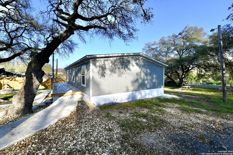 Front exterior of a new home in , San Antonio, TX, highlighting curb appeal (Image 22).