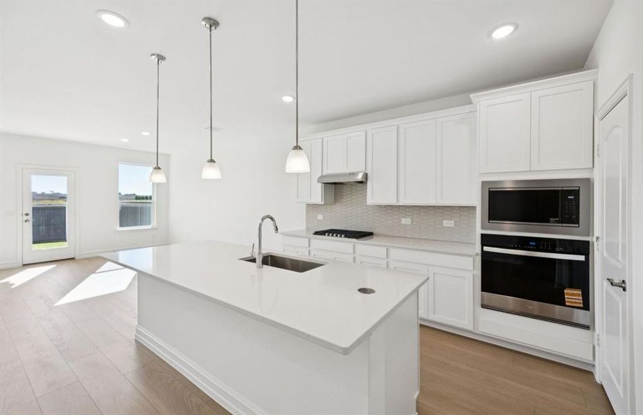Spacious kitchen with eat-in bar top island