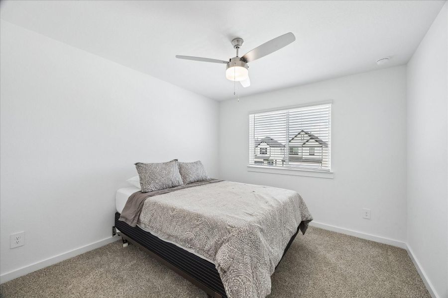 One of two secondary bedrooms. Both bedrooms (2 and 3) are at the back of the home. One of two secondary bedrooms. Both bedrooms (2 and 3) are at the back of the home.